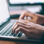 Someone typing on their keyboard