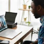 A person smiling while on a zoom call