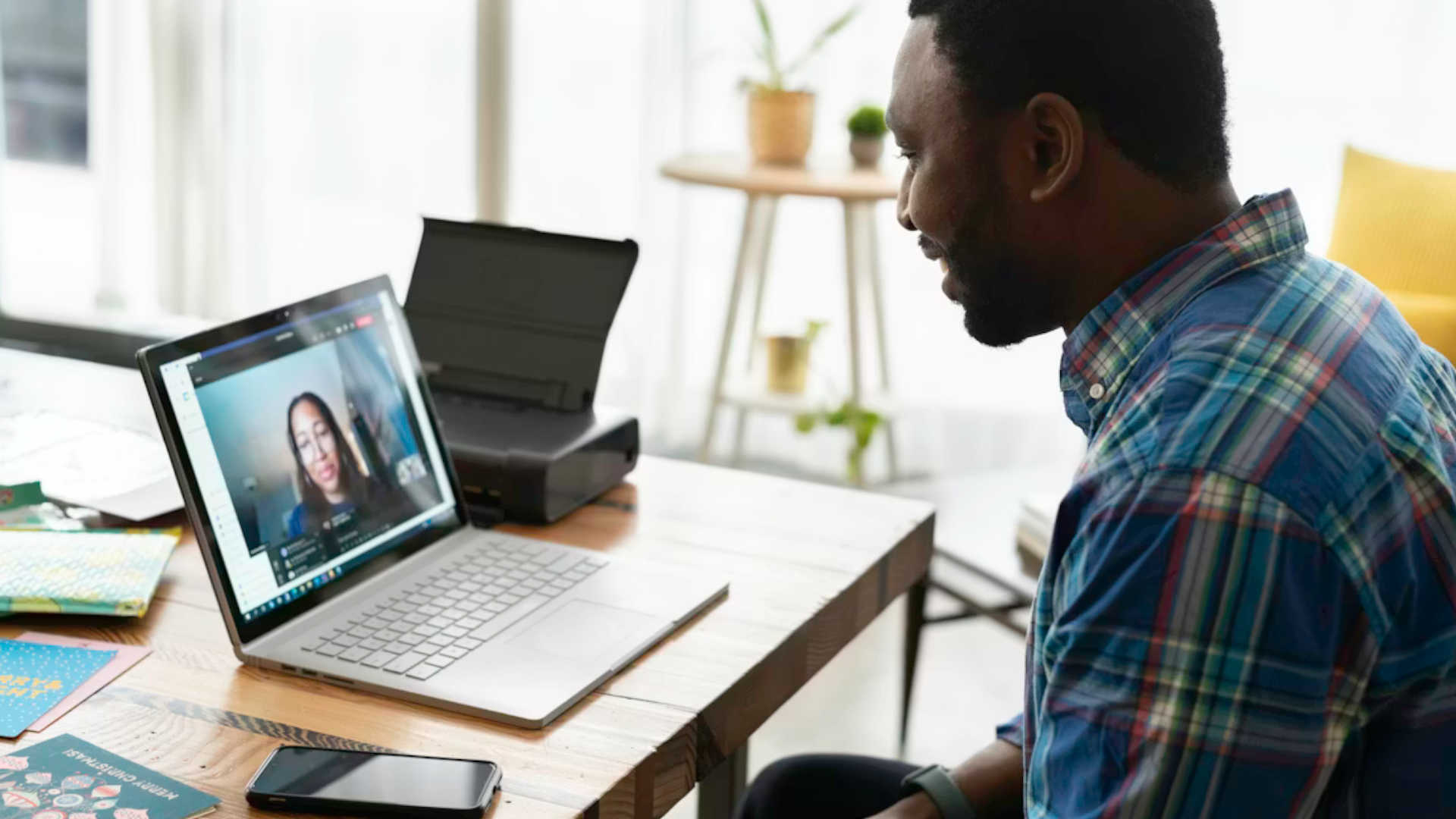 A person smiling while on a zoom call